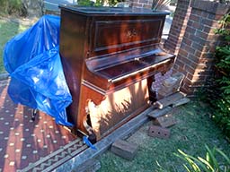 image of unwanted piano for disposal 1